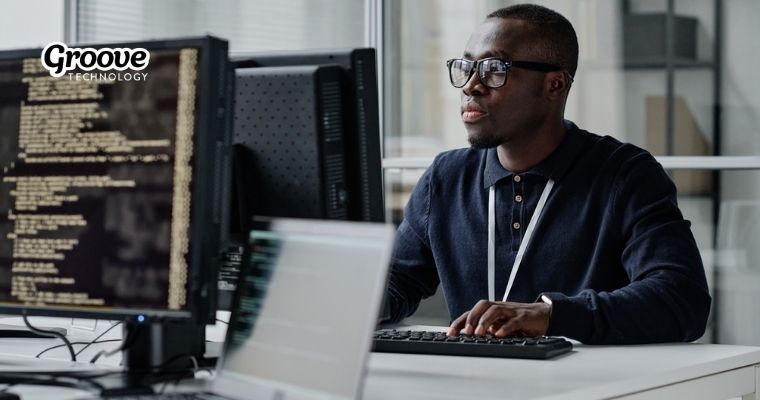 Team of developers collaborating efficiently through flexible staff augmentation to meet project demands and optimize costs.